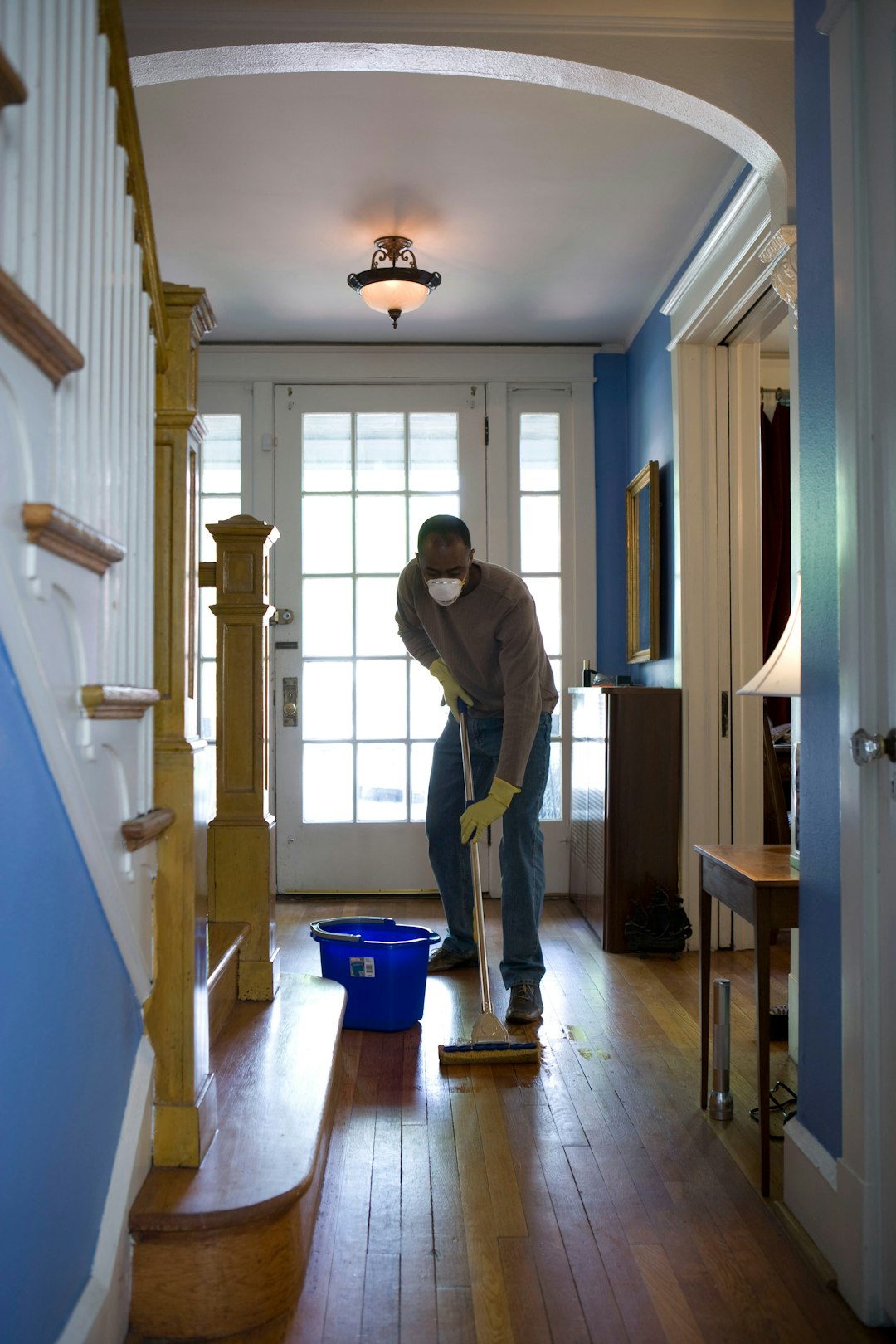hero-01 This African-American man was in the process of damp-mopping his home’s entrance way. In this way airborne particulates including dust and pollen, could be removed from the inside of his home, thereby, reducing the detrimental effects these substances have upon the respiratory system of his family members. These irritants can sometimes result in sinus infections, and asthma.